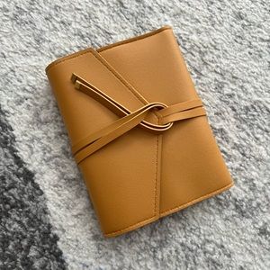 The Katherine Tech Organizer Roll mustard yellow make up travel organizer